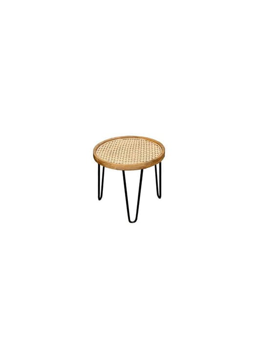 "Antique-finish wood and rattan nesting table detail"