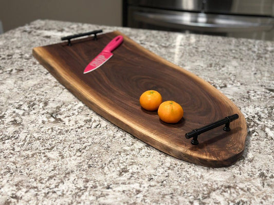 Black sheesham live edge serving board with metal handles