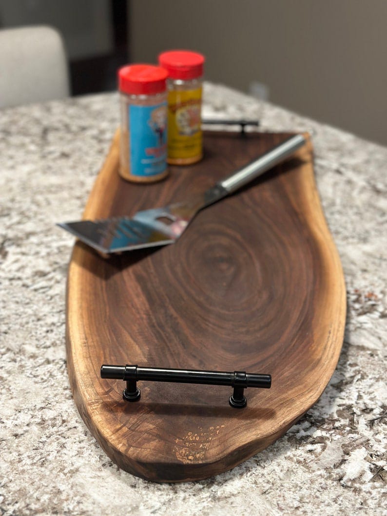 Black sheesham live edge serving board with metal handles