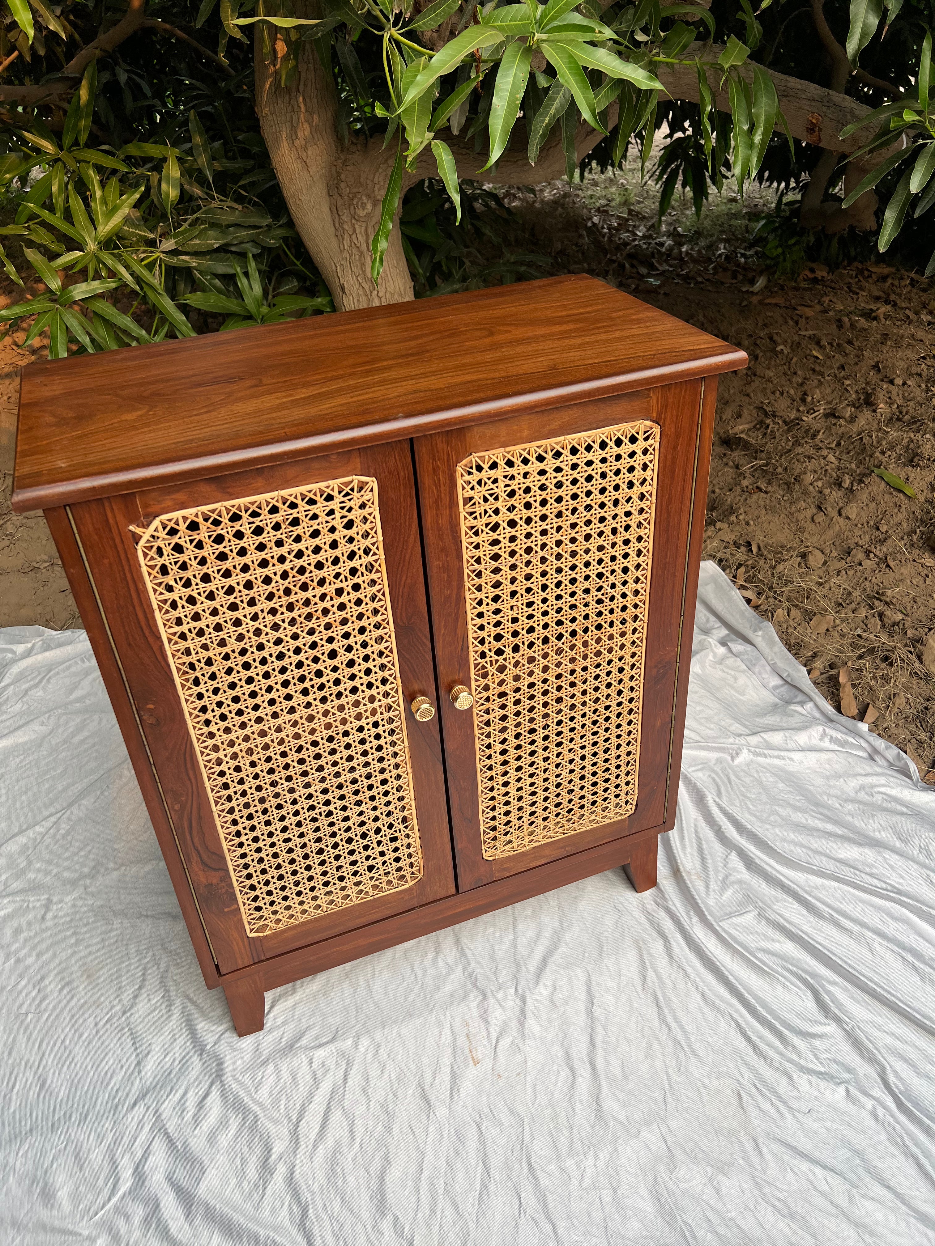 Close-up of hand-woven cane panel on Moro rattan cabinet doors