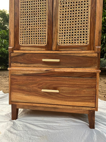 Close-up of wood grain and cane weave texture on rattan cupboard