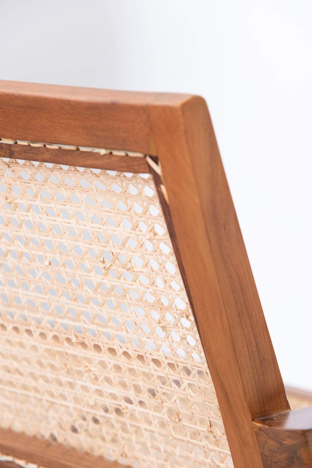 Close-up of wood grain and rattan weave texture