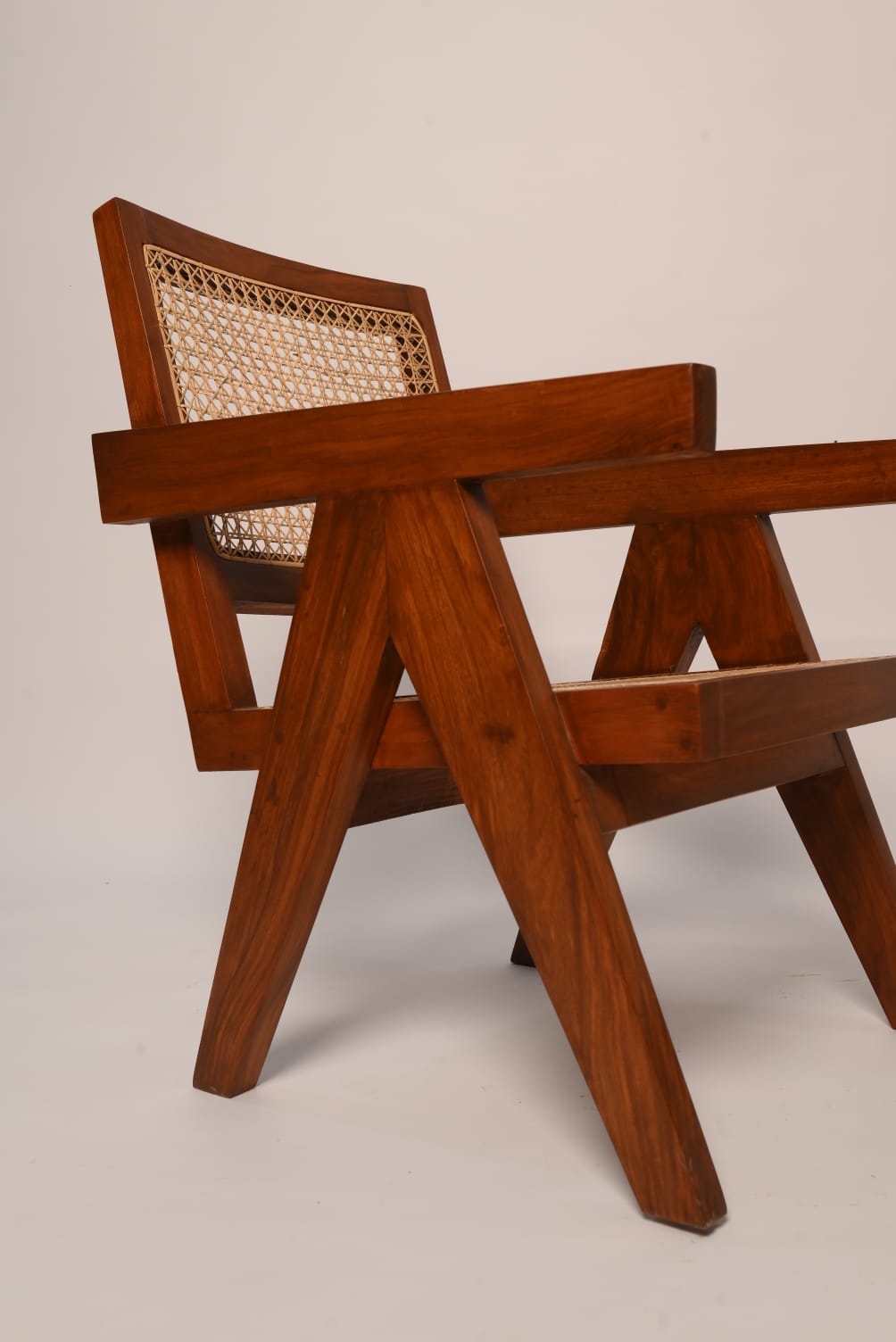 "Close-up of woven cane backrest on Virsa rattan chair"
