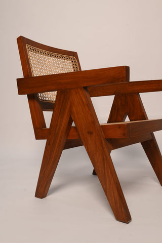 "Close-up of woven cane backrest on Virsa rattan chair"