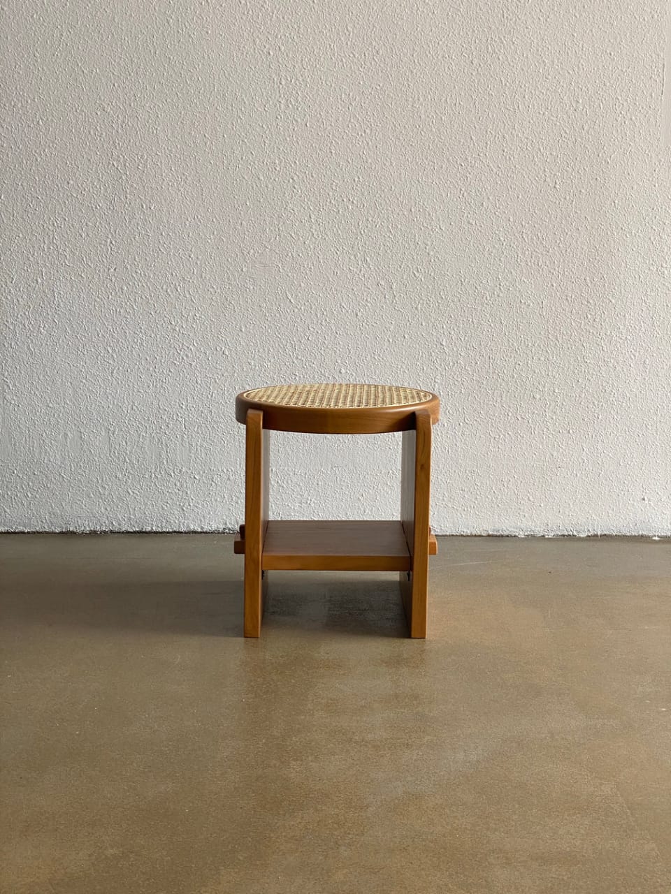 "Close-up of woven rattan base on Loom side table"