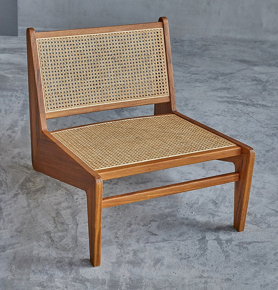 "Close-up of woven rattan seat on lounge chair"