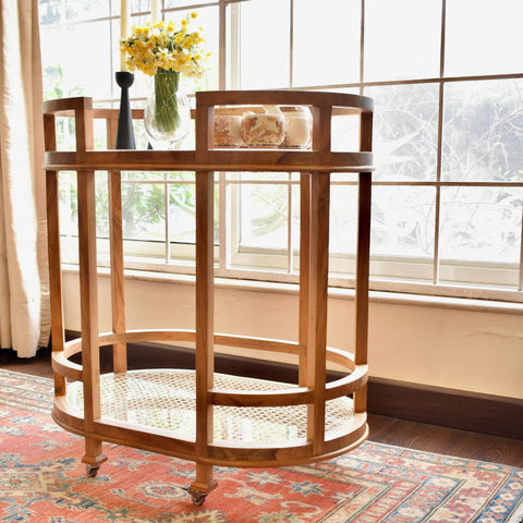 "Close-up of woven rattan shelf on tea trolley"