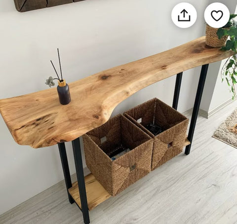 Console table close-up showing black hairpin leg detail