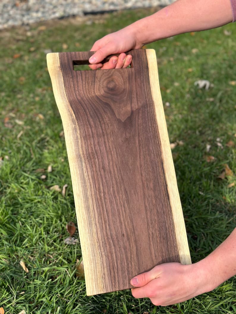 Dark sheesham wood serving tray with inset handles and live edge