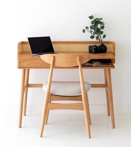Front view of Canelin study table showing woven cane detailing