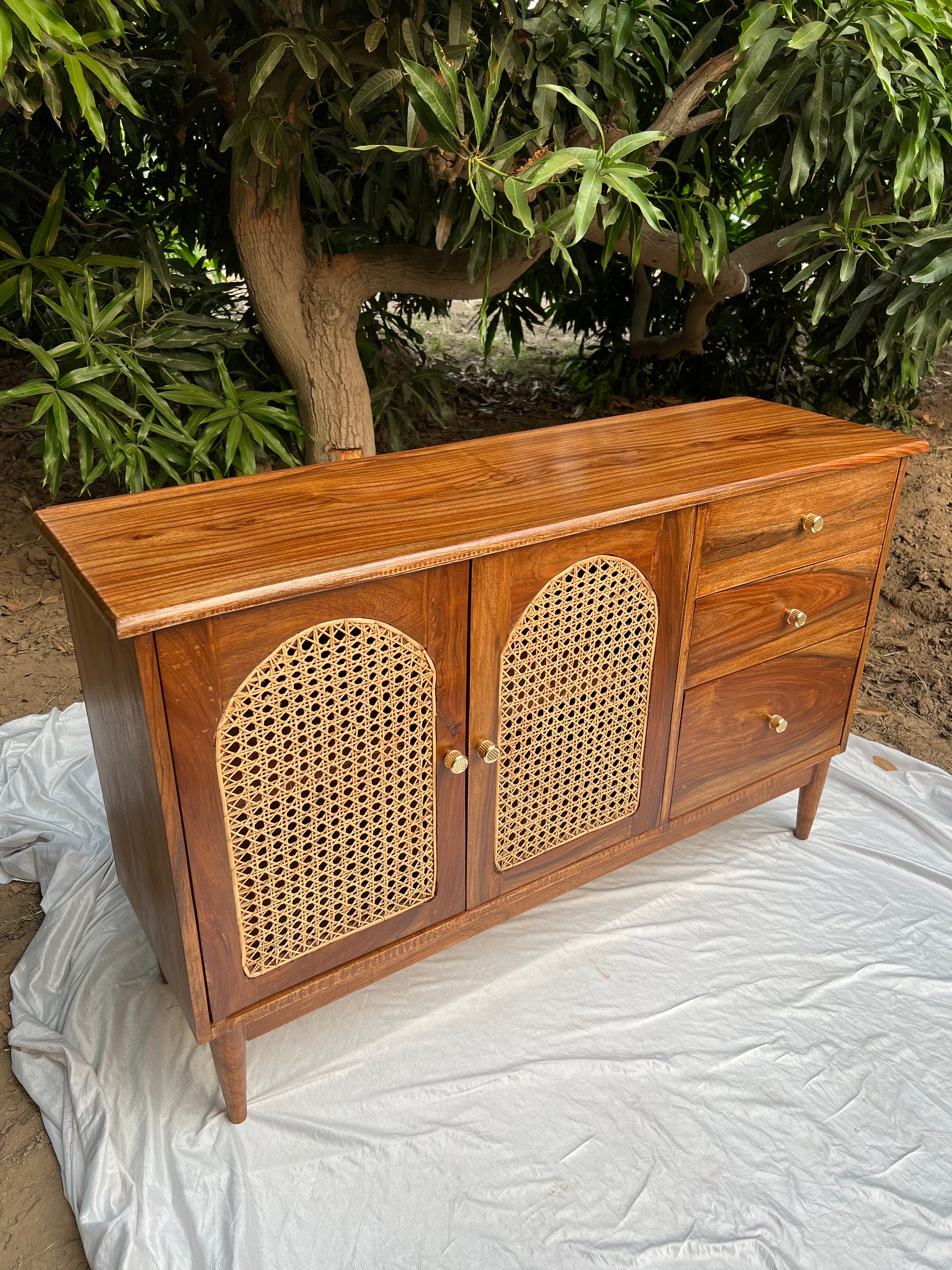 Front view of Ravi rattan chester showing woven cane doors