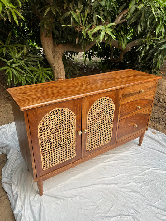 Front view of Ravi rattan chester showing woven cane doors
