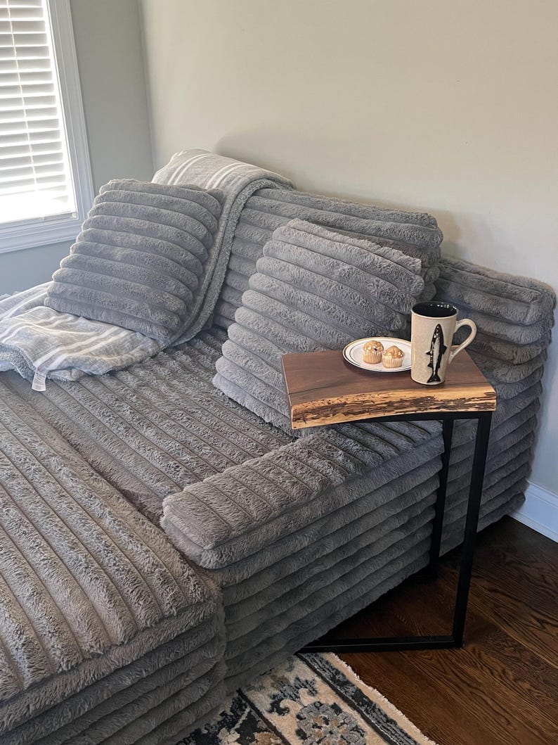 Glossy finish live edge wood end table, close-up of grain pattern