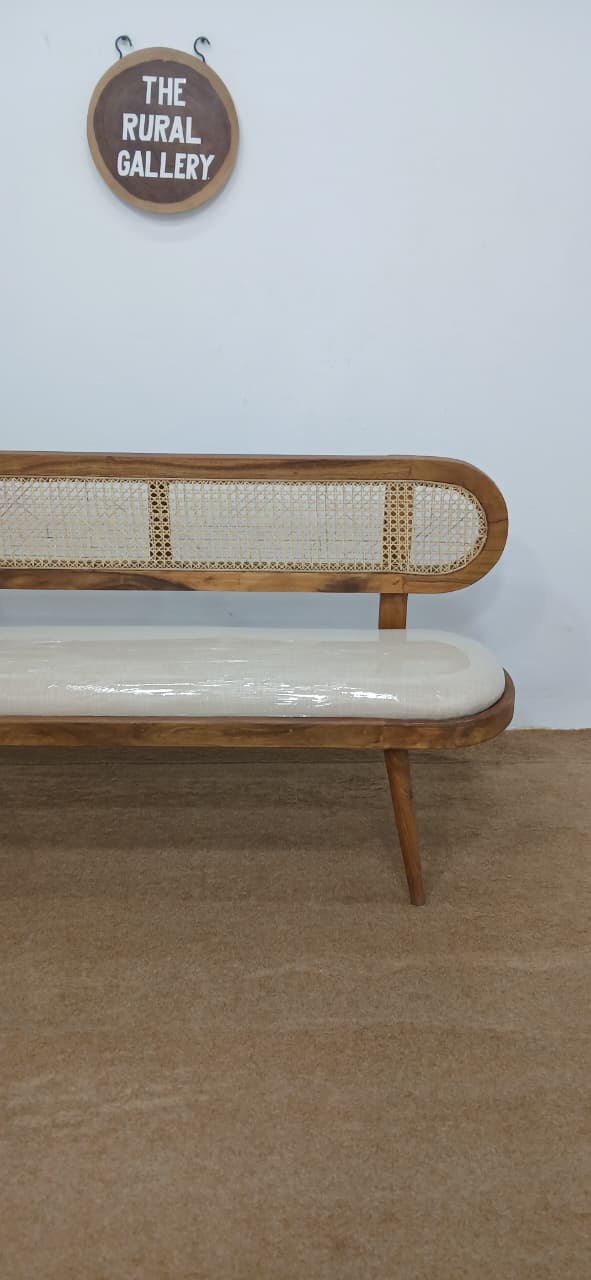 Handwoven rattan seat detail on RootCraft wooden bench