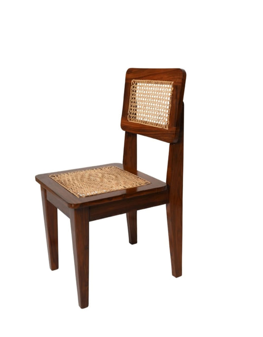 "Heritage rattan dining chair with cane backrest and wood frame"