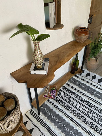 Live edge console table styled with decor accents