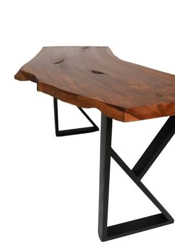 Live edge desk close-up showing natural curved edge