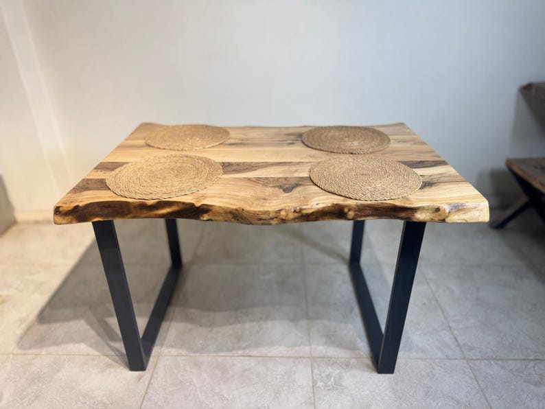 Live edge dining table with metal legs, side angle