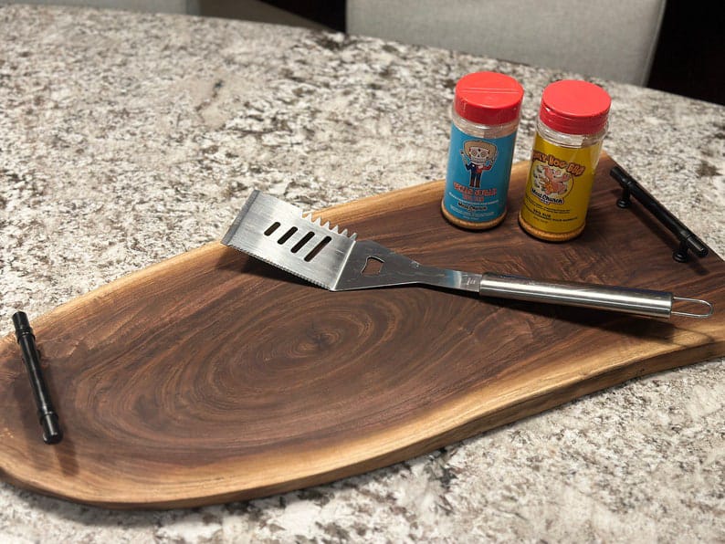 Live edge serving board styled with food, top view