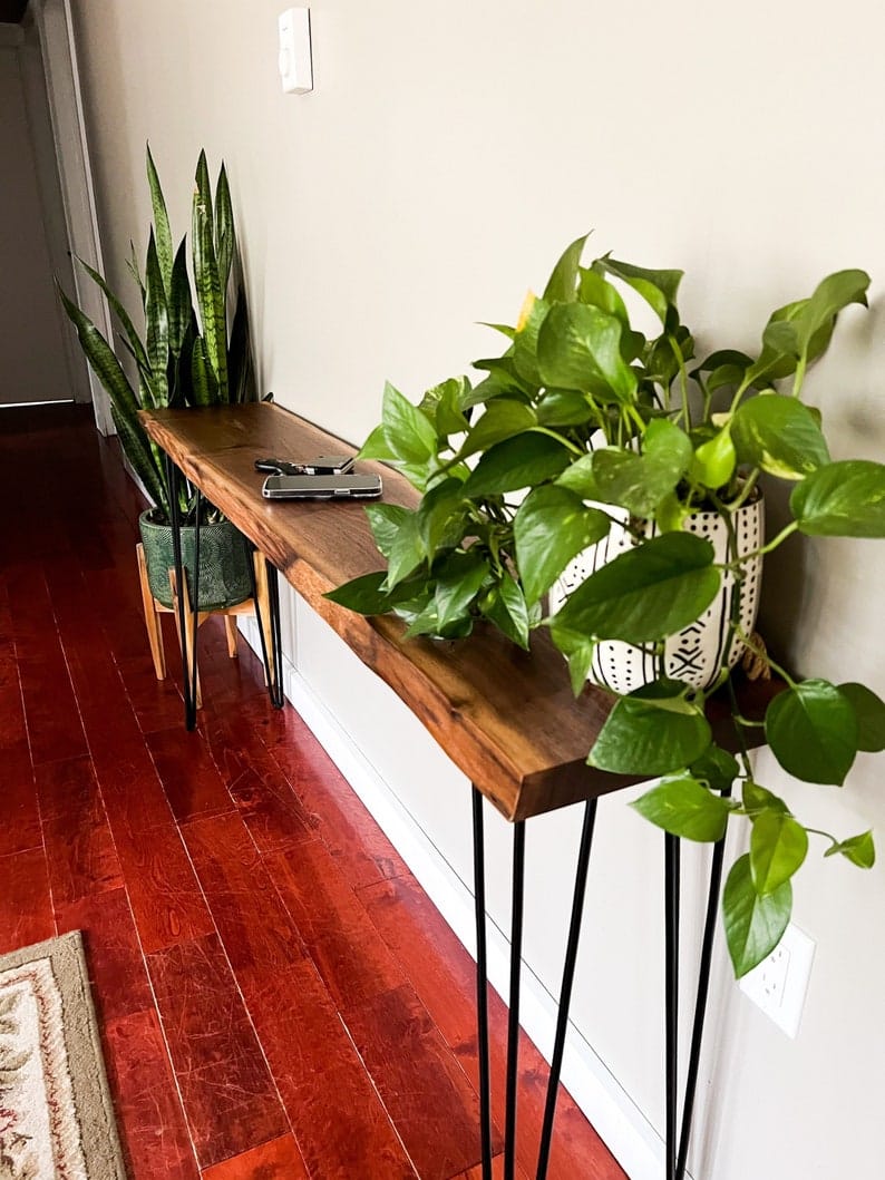 Live edge sheesham console styled in an entryway