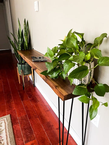 Live edge sheesham console styled in an entryway