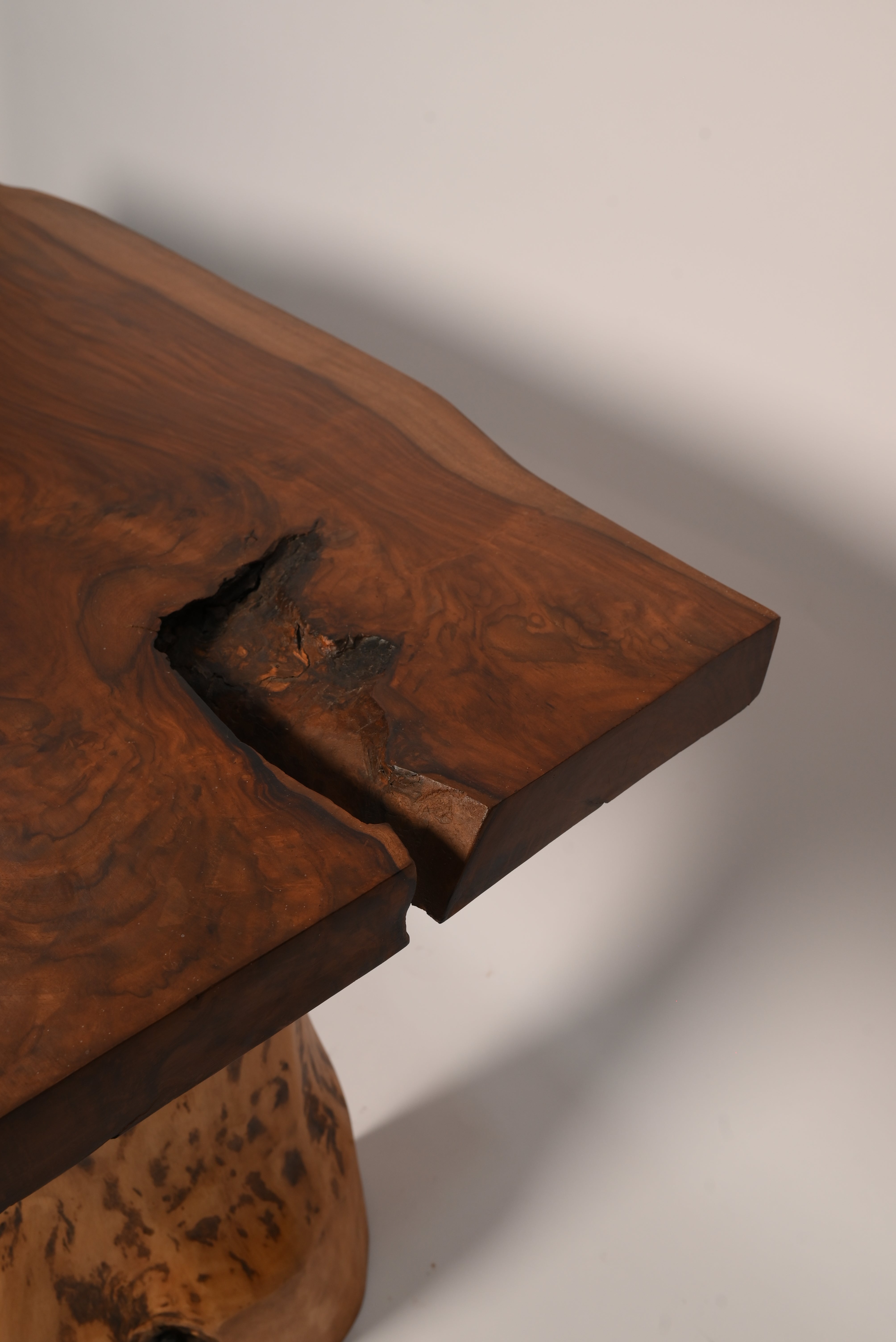 "Live edge sheesham dining table edge close-up"