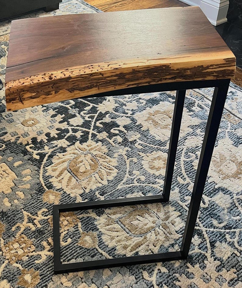 Live edge sheesham end table styled beside a sofa