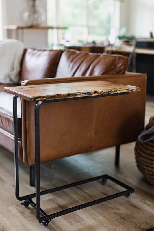 Live edge side table, close-up of wood grain and metal frame