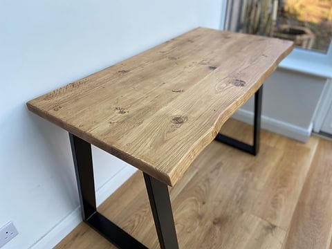 Live edge study desk close-up showing wood grain