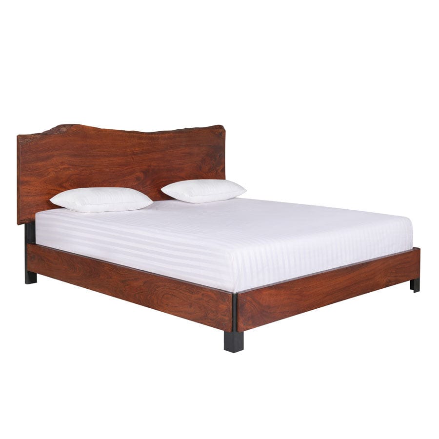 Live edge wood bed close-up showing headboard grain detail