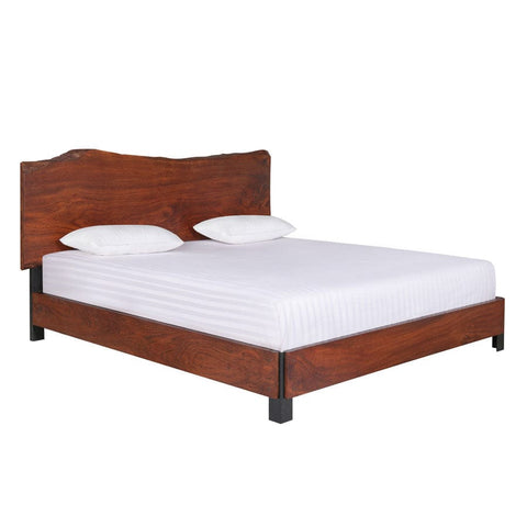 Live edge wood bed close-up showing headboard grain detail