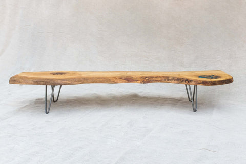 Live edge wood bench styled with plants
