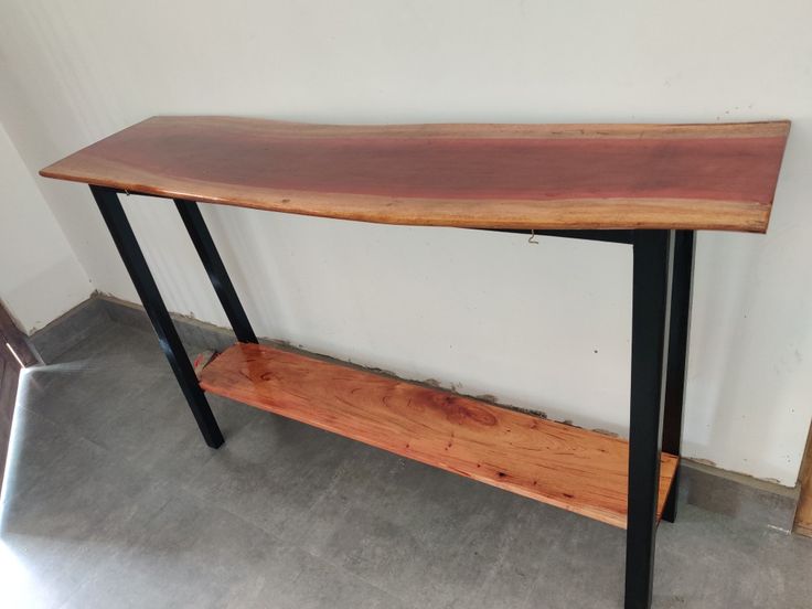 Live edge wood console table styled in hallway