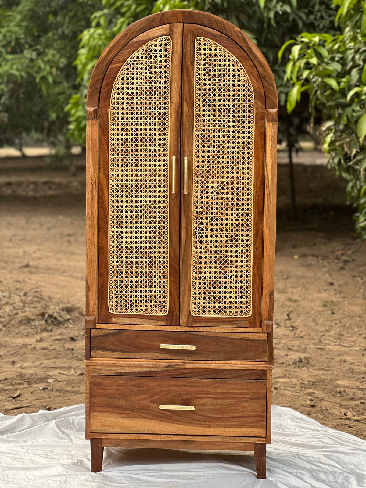 "NaturalNest canework cupboard with woven cane panels"