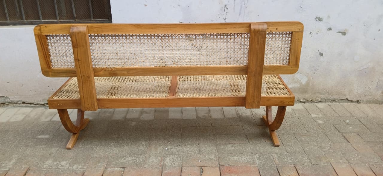 Rattan bench placed near a dining table