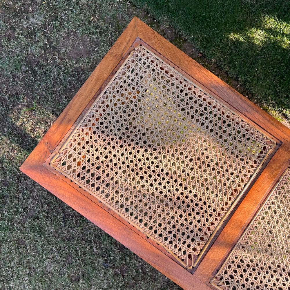 "Rattan bench side view, glossy finish"