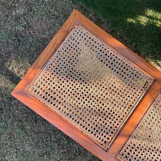 "Rattan bench side view, glossy finish"