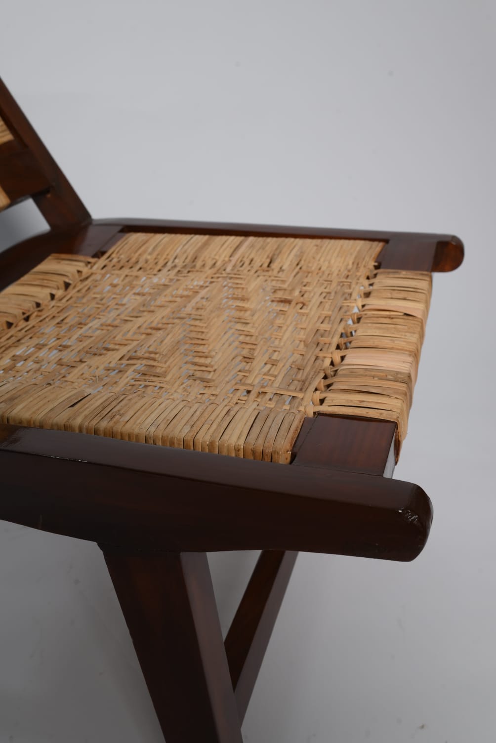 "Rattan comfort chair full profile view"
