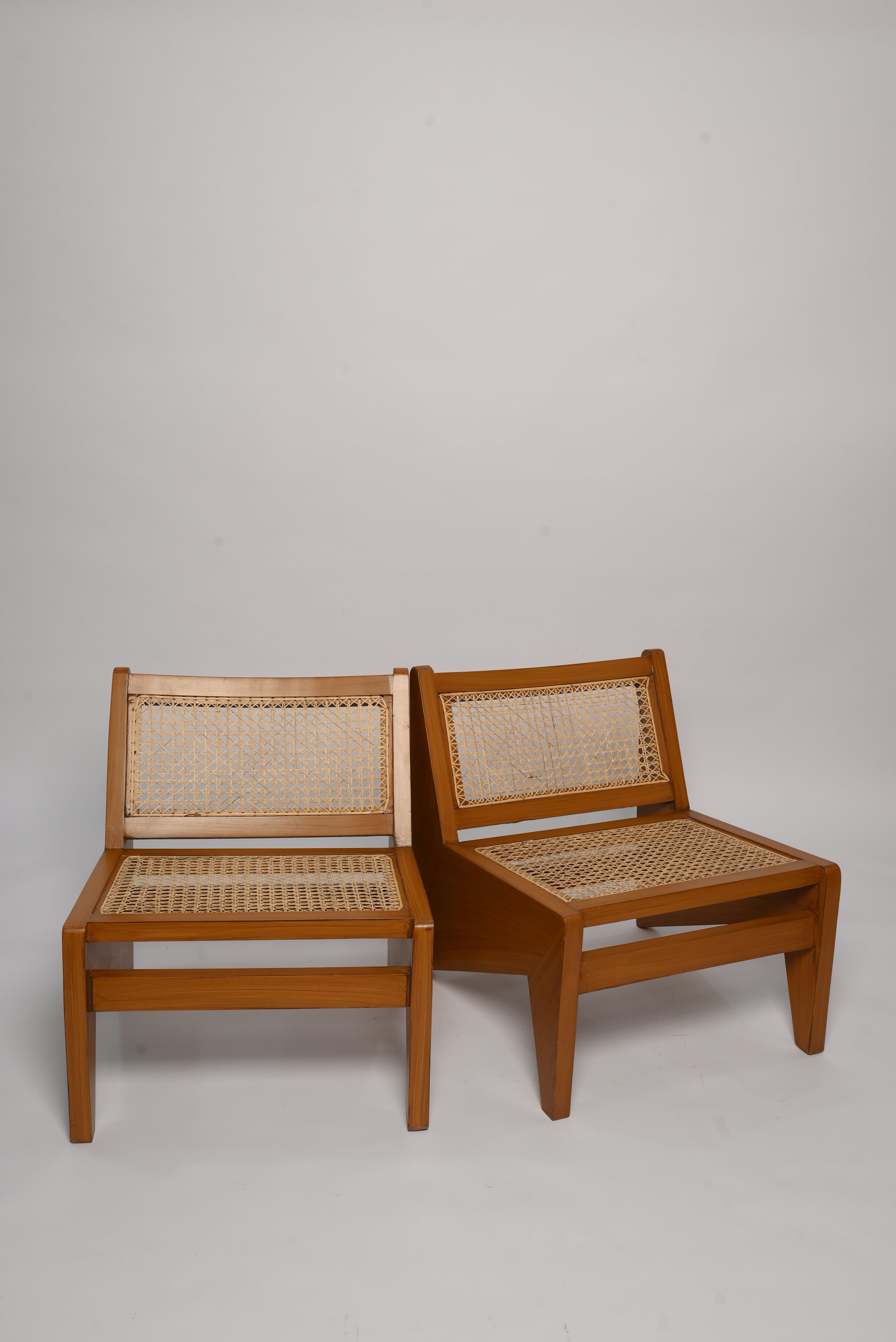 "Rattan lounge chair front view, glossy finish"