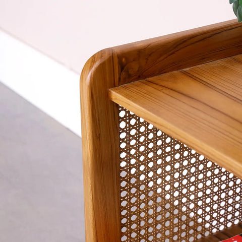 "Rattan mesh side table styled in living room corner"