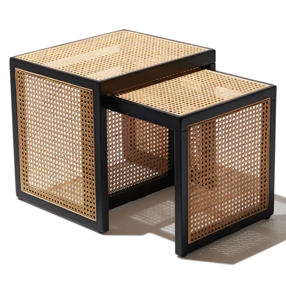 "Rattan nesting tables tucked together to save space"