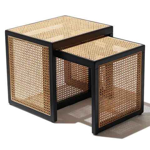 "Rattan nesting tables tucked together to save space"