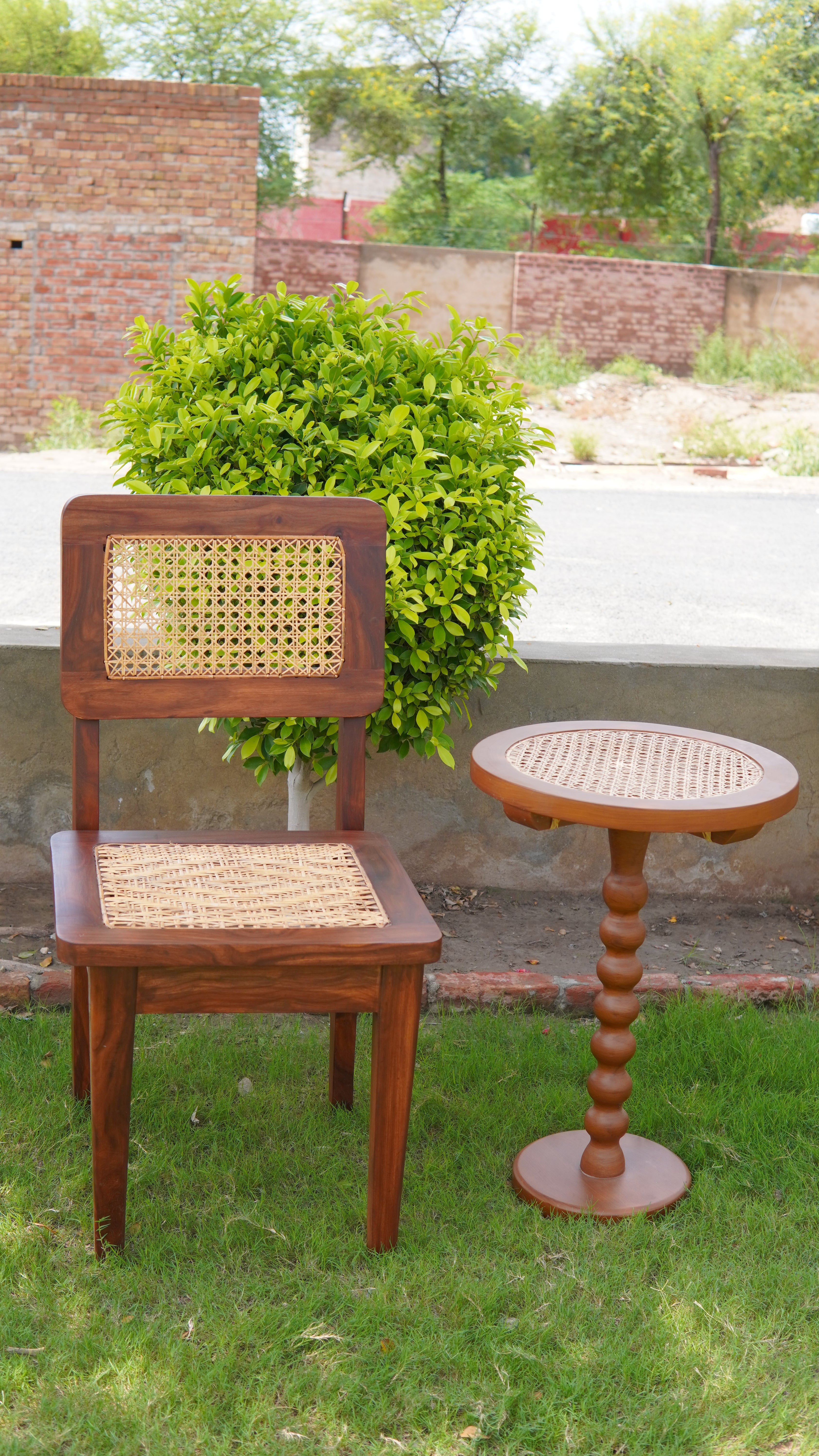 "Rattan side table alternate angle, glossy finish"