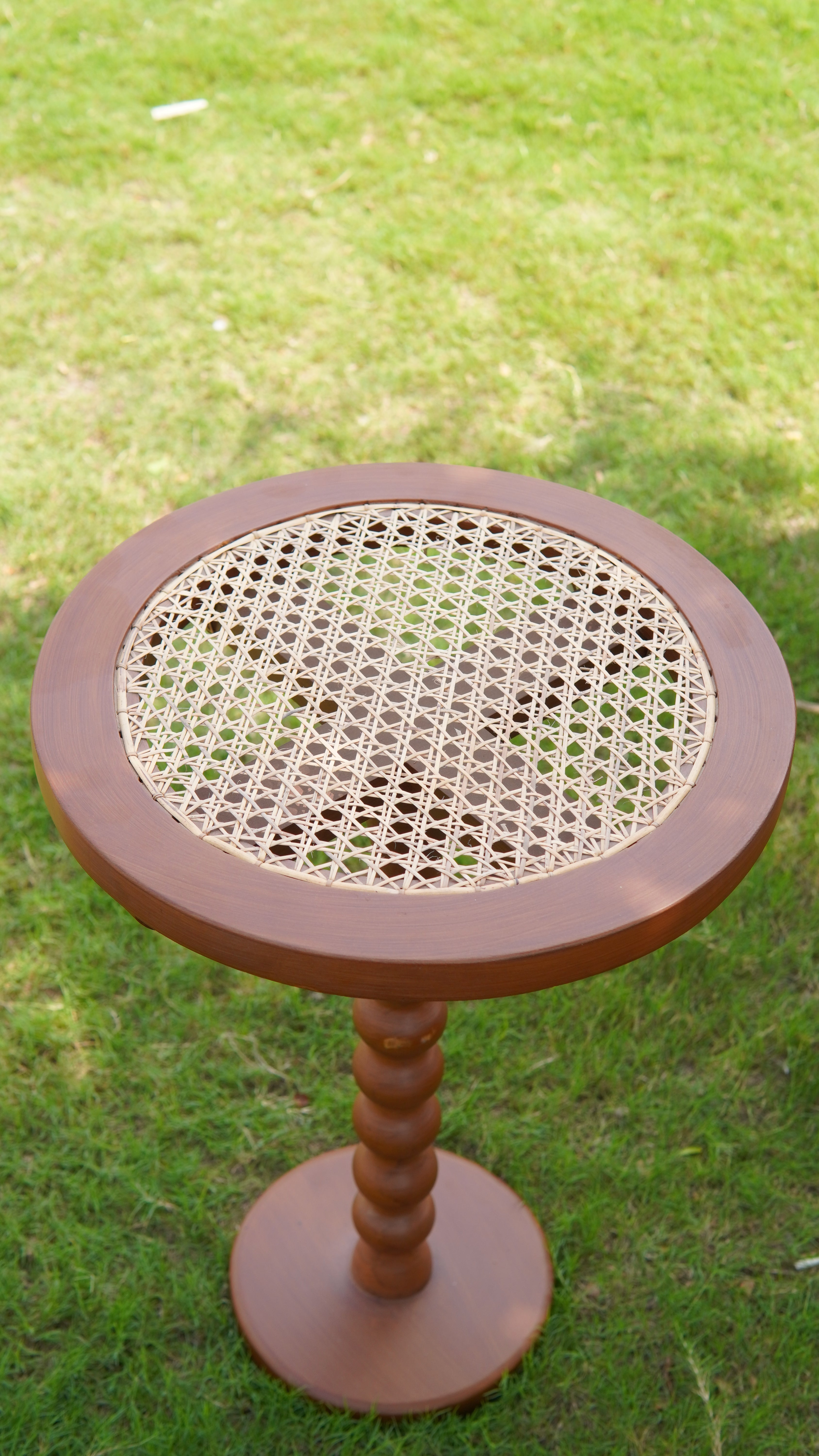 "Rattan side table used on covered patio"
