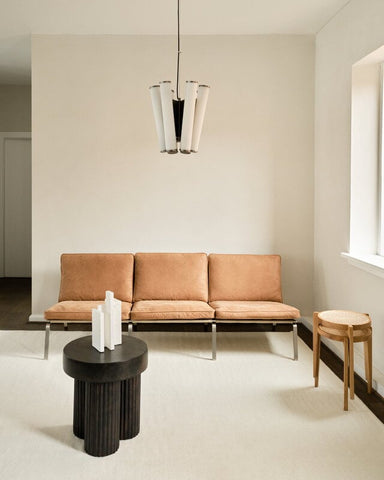 "Rattan stool used as footrest"