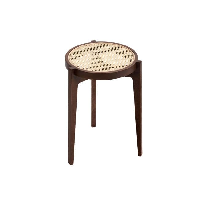 "Rattan stool used as plant stand"