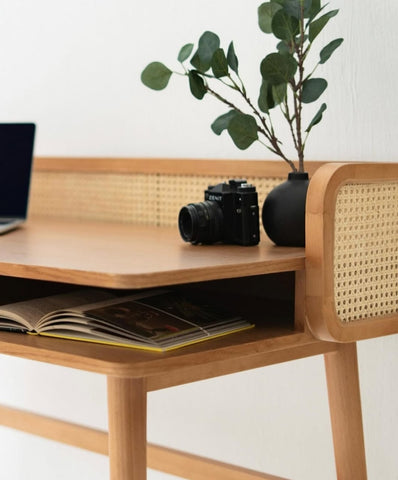 Rattan study table styled in a home office setting