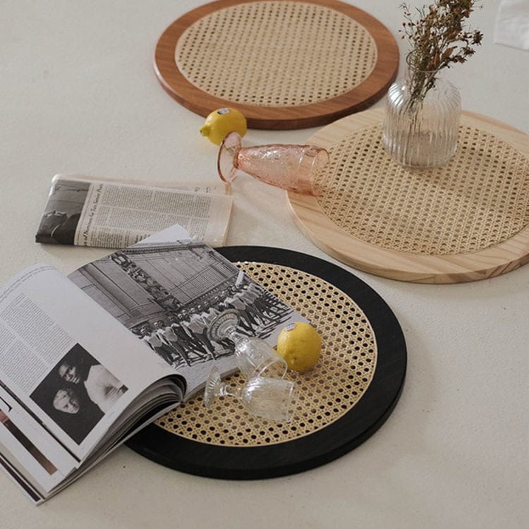 "Rattan tray used to hold plants or candles"