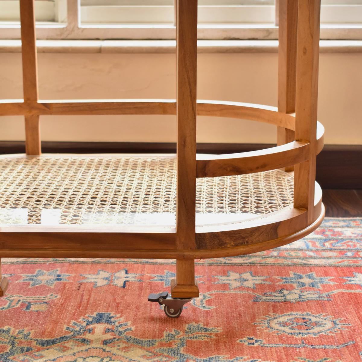"Rattan trolley used as plant display stand"