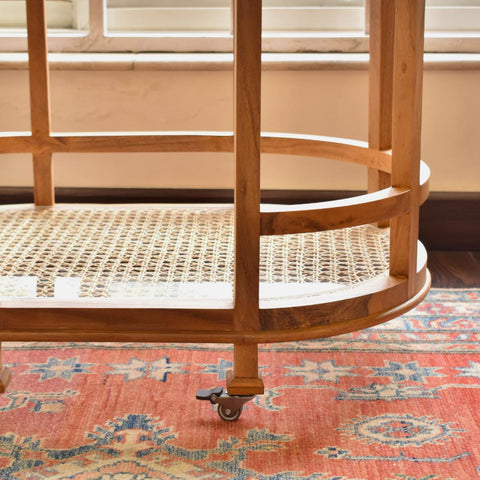 "Rattan trolley used as plant display stand"